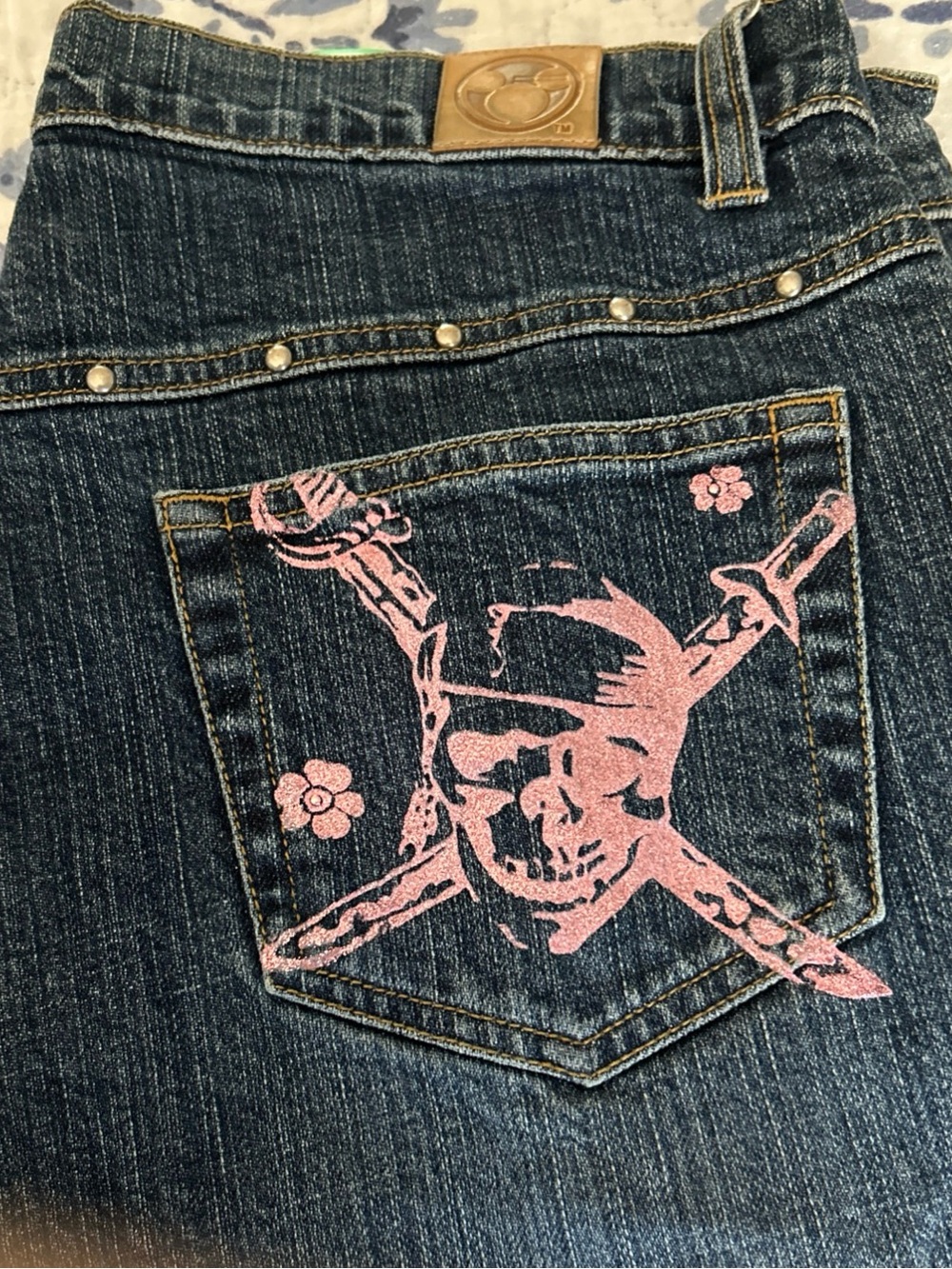 Disney Women's Dark Blue Denim Bootcut Jeans with Pink Skull Pocket Print